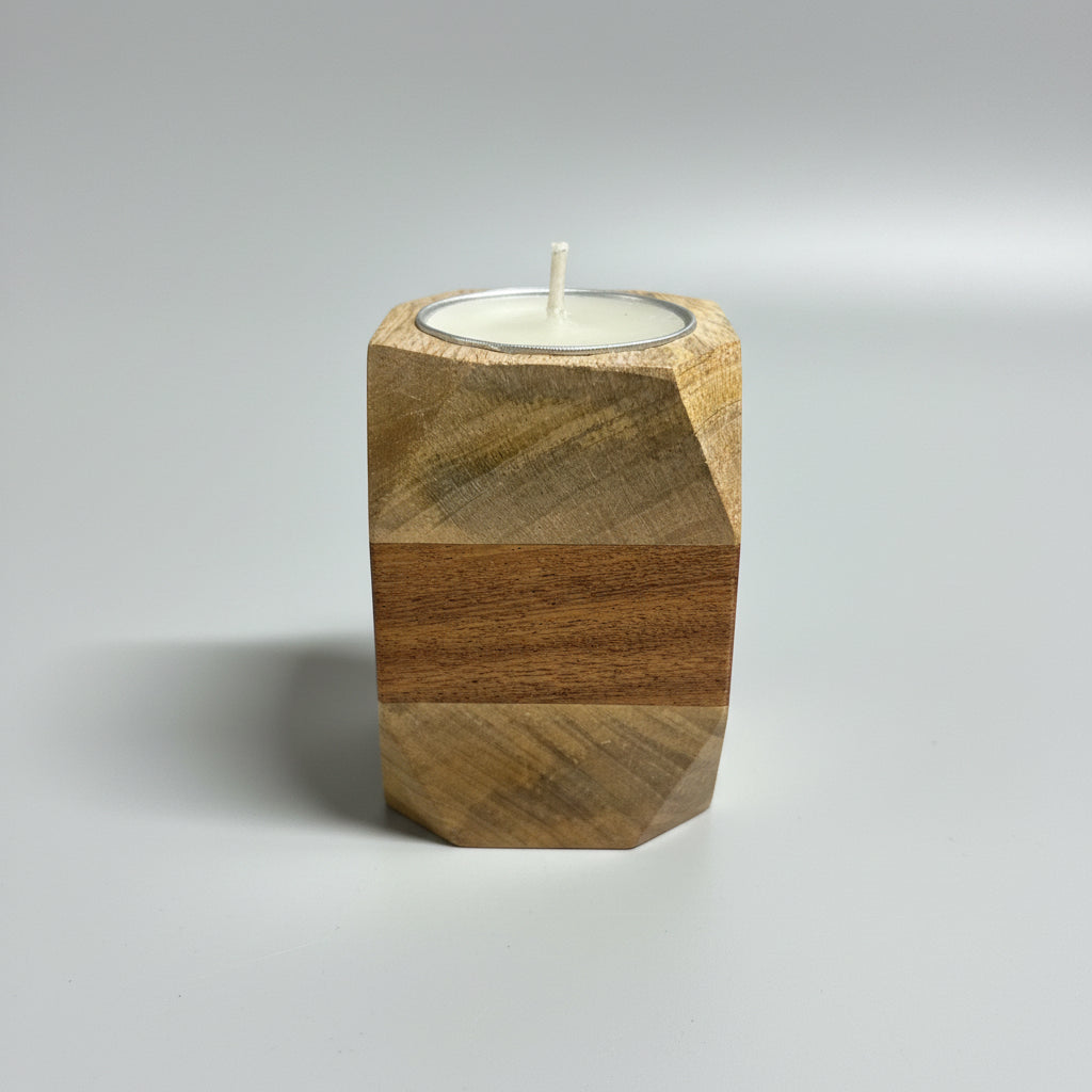 Wooden candle holder with a candle on a dark surface
