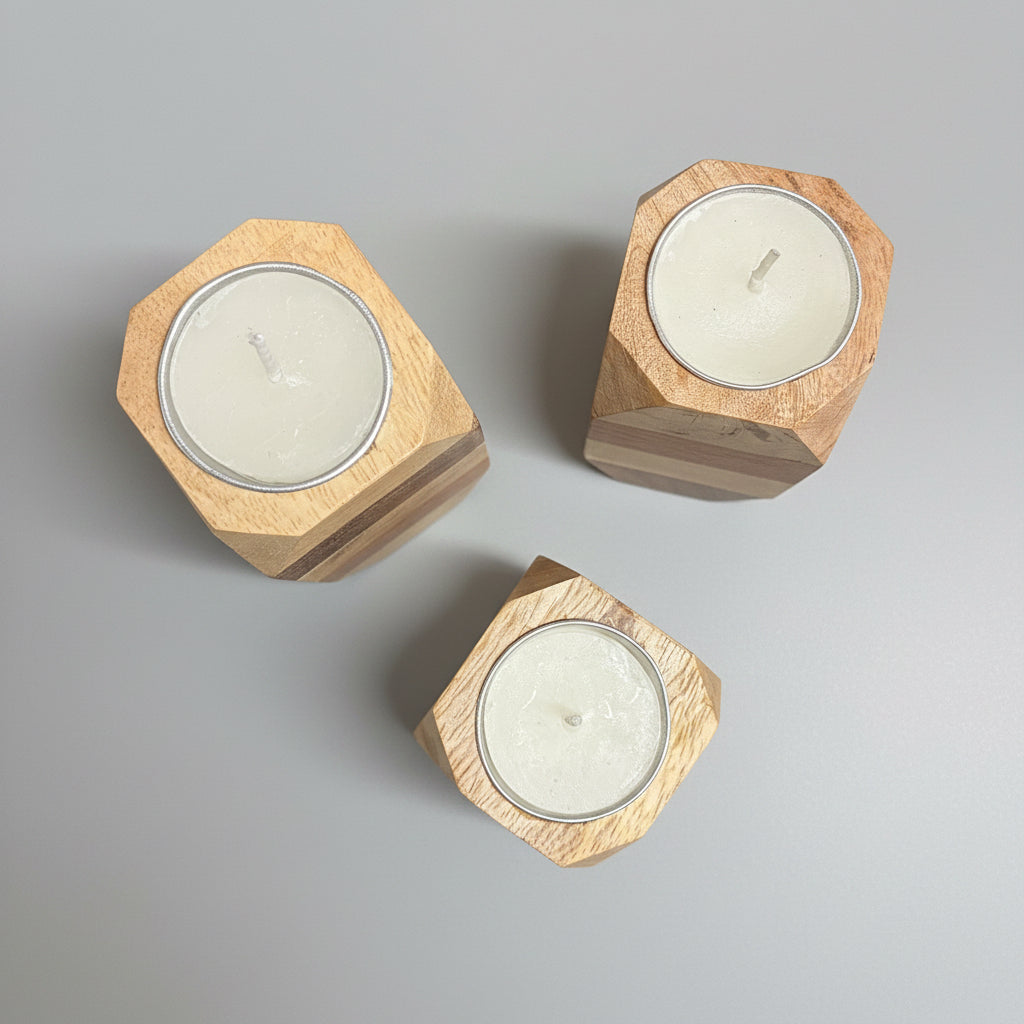 Three hexagonal wooden candle holders with candles on a dark surface