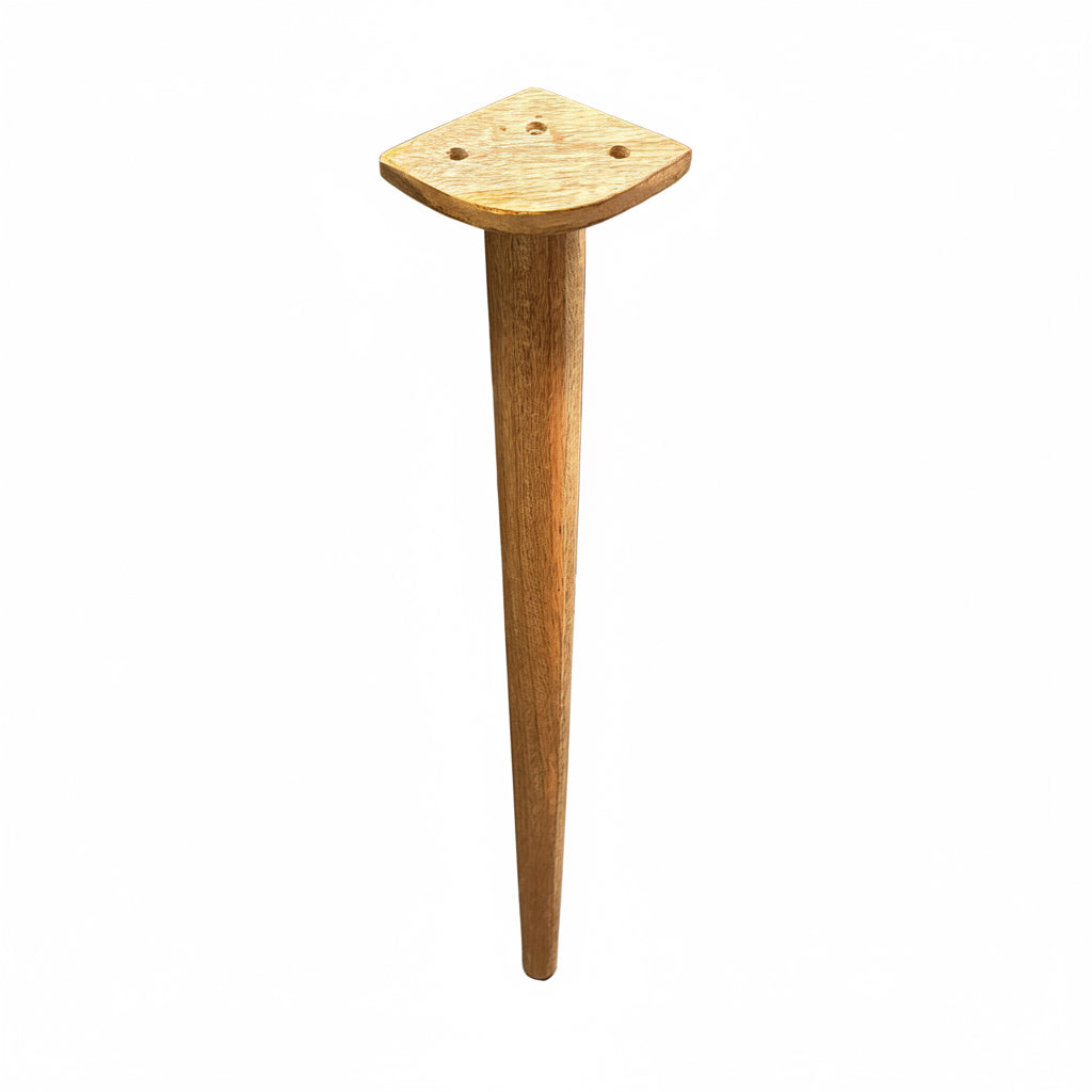 Wooden spindle on a concrete floor with a wooden surface in the background