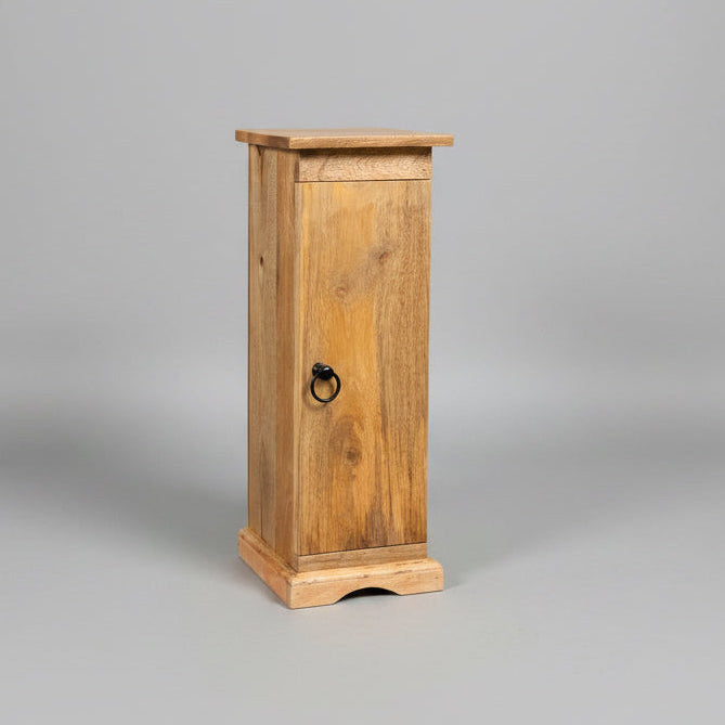 A rustic wooden cabinet with a single door and a black metal ring pull handle, standing on a concrete floor in a workshop environment.