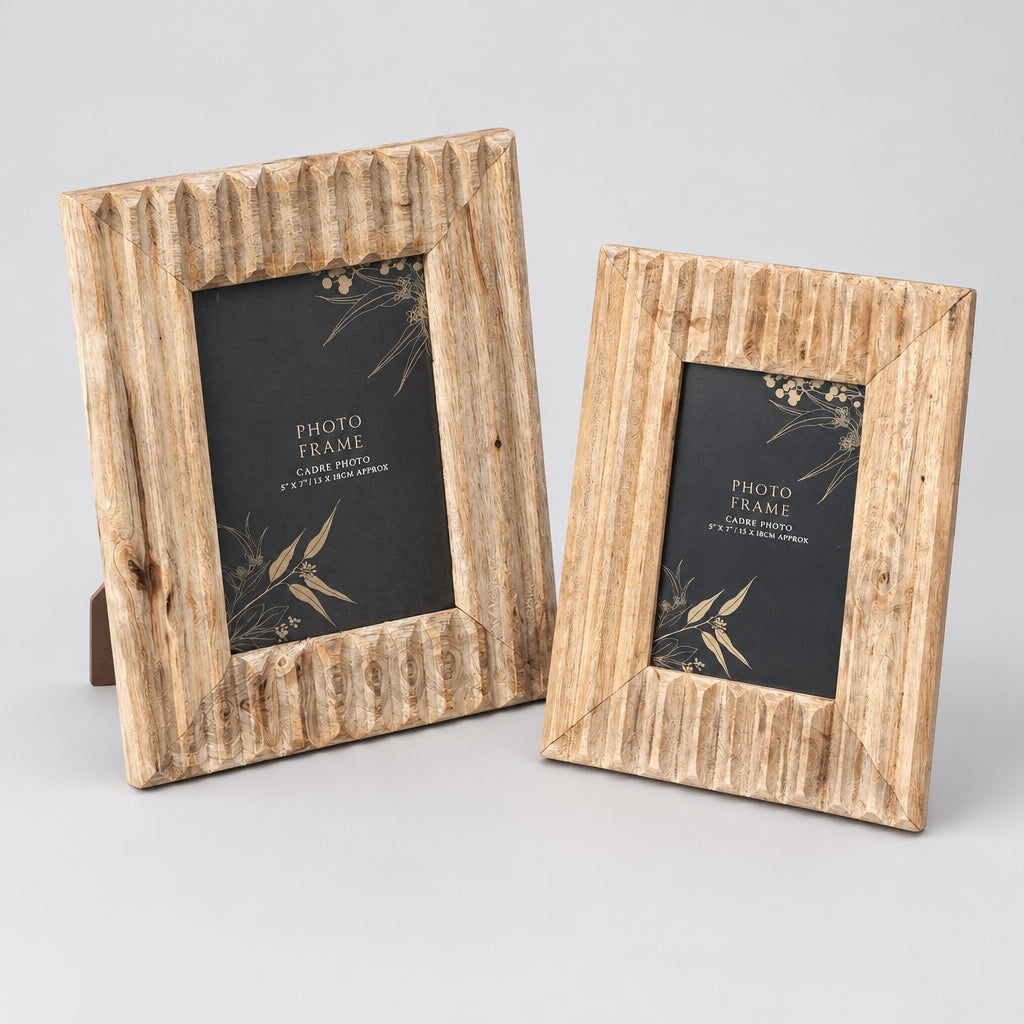Two rustic wooden photo frames with textured, ribbed edges, one larger and one smaller, displayed on a weathered wooden pallet outdoors.