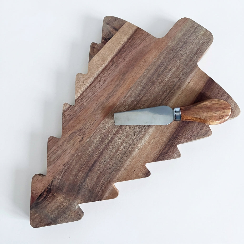 An irregularly shaped wooden serving board with a handcrafted wood grain finish, styled on a matching wood surface with a small metal spatula resting on top.