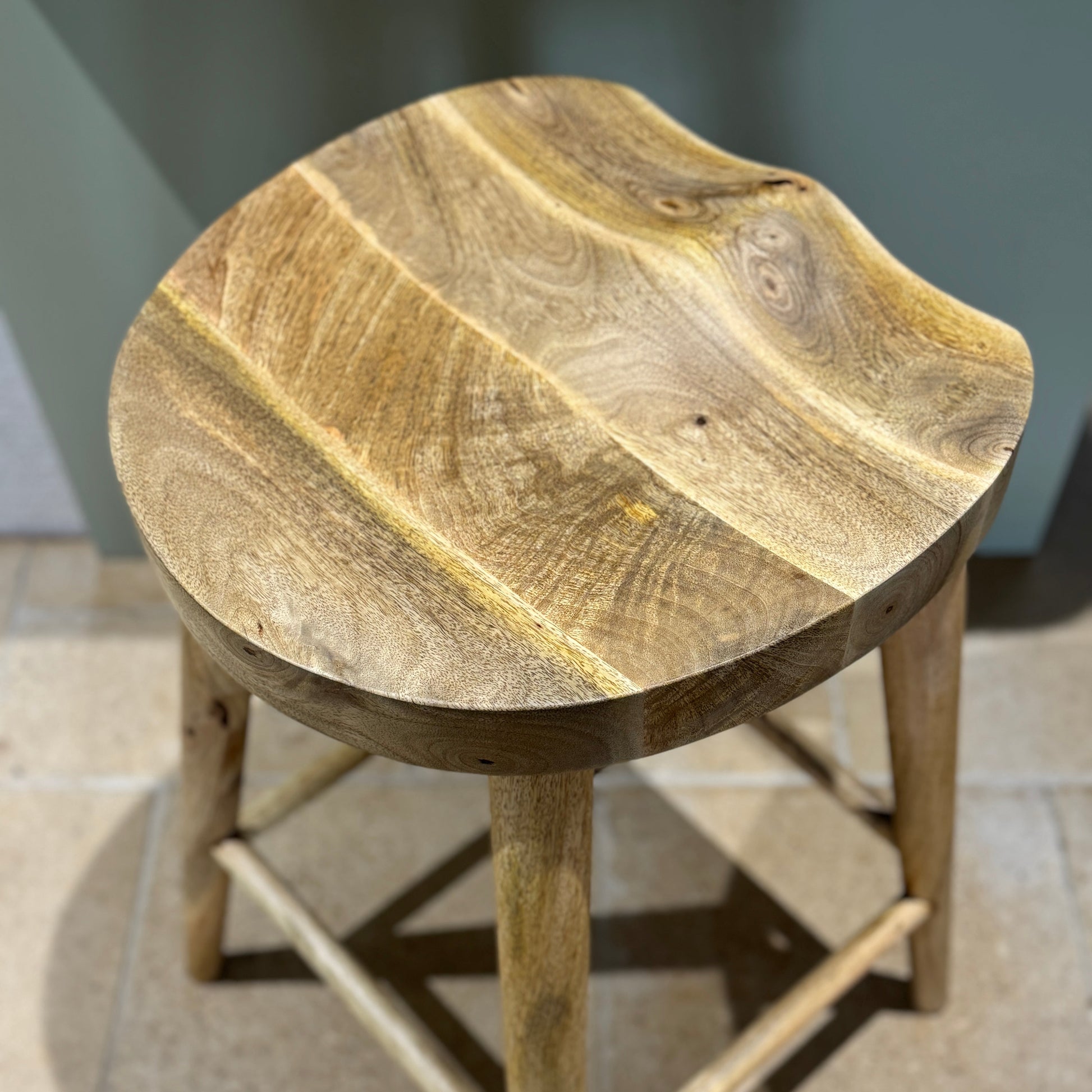 Mango wood bar stool with scalloped seat from above