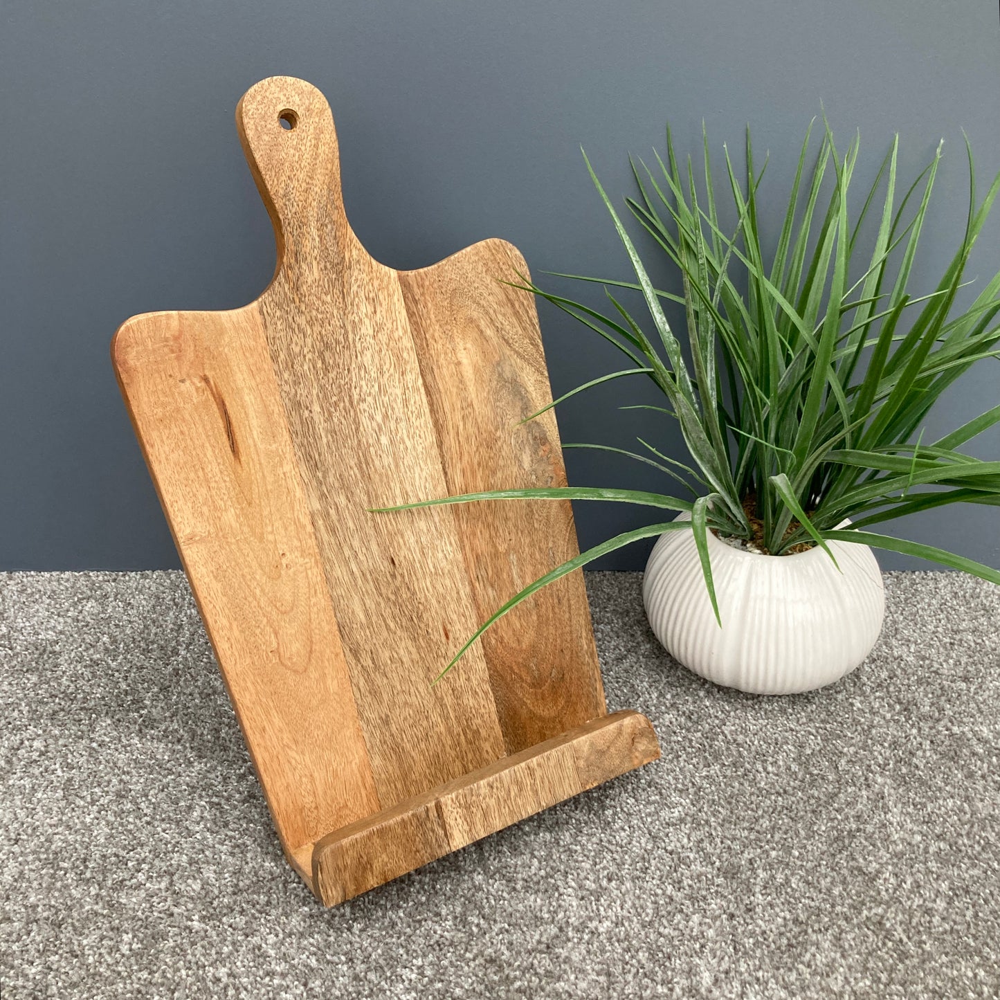 Mango wood recipe stand with handle display with green plant