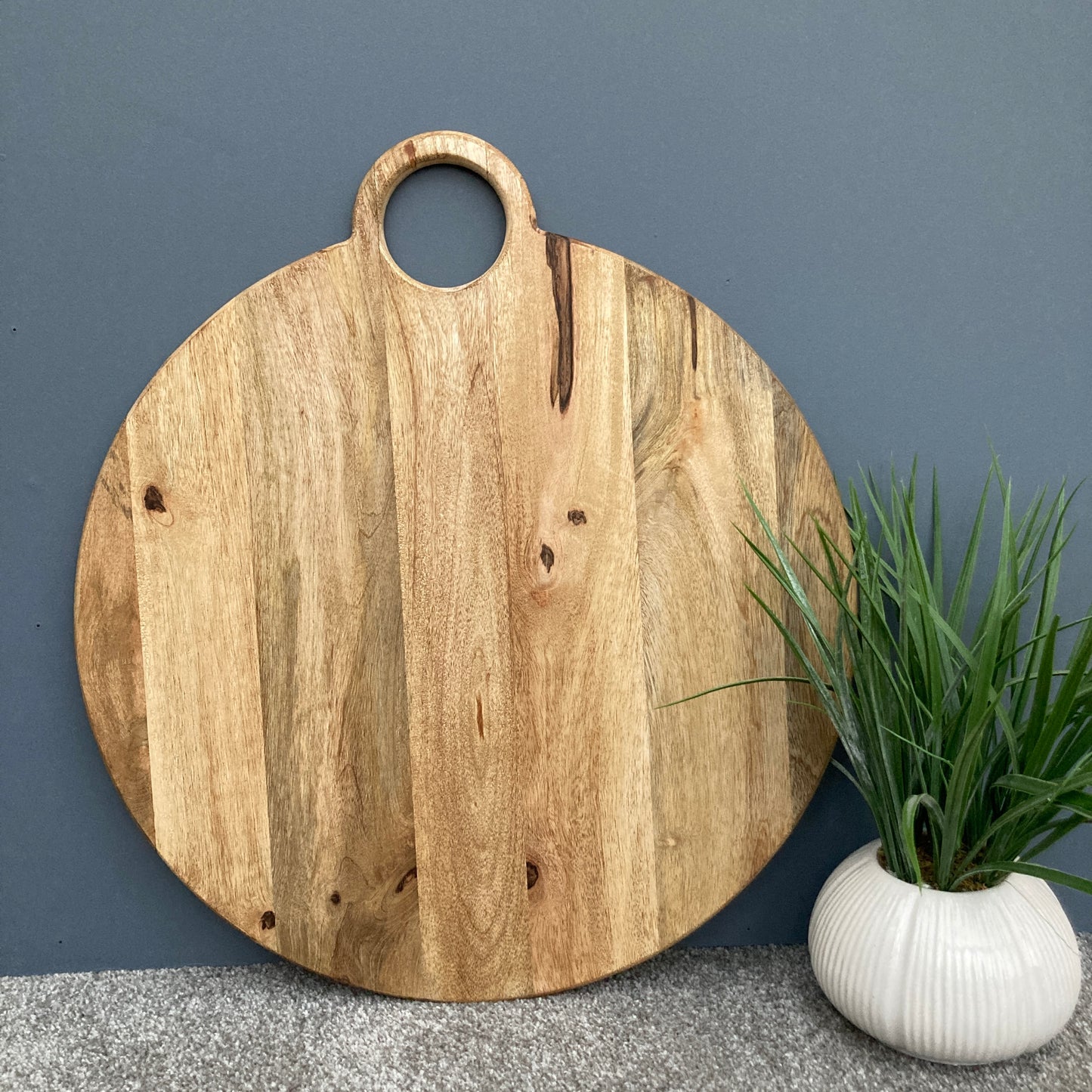 Round loop handled food boards made from solid Mango wood. Individual