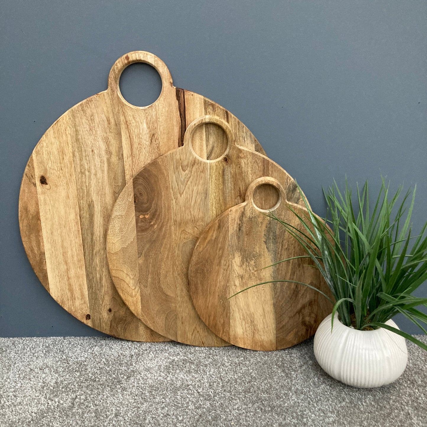 Round loop handled food boards made from solid Mango wood. Set of 3