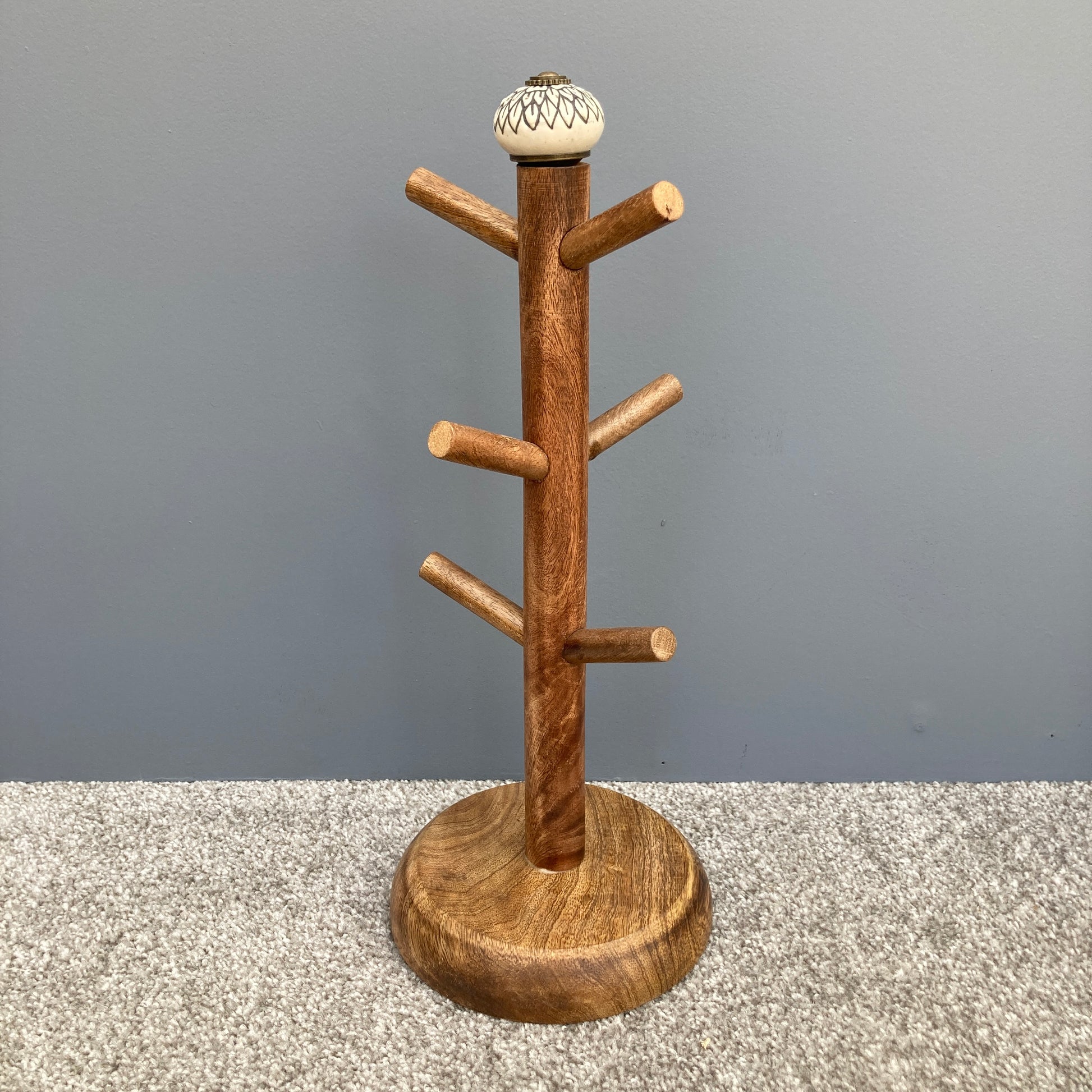 Dark Mango wood mug tree to hold up to 6 cups. 2 designs. One design.