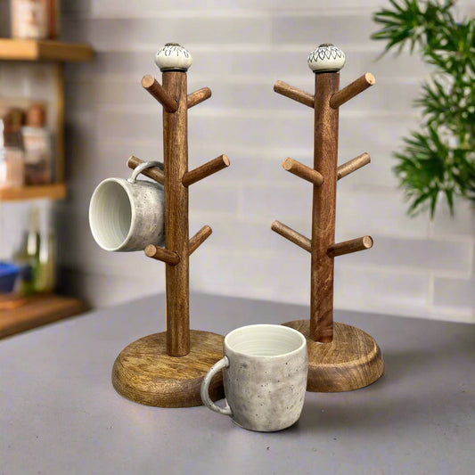 Dark Mango wood mug tree to hold up to 6 cups. 2 designs. Both designs shown with mugs