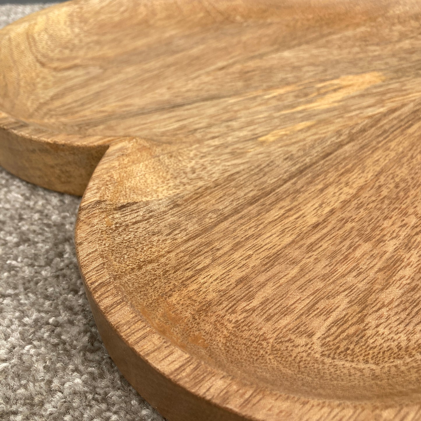 Hand carved solid Mango wood wooden heart dish / board close up