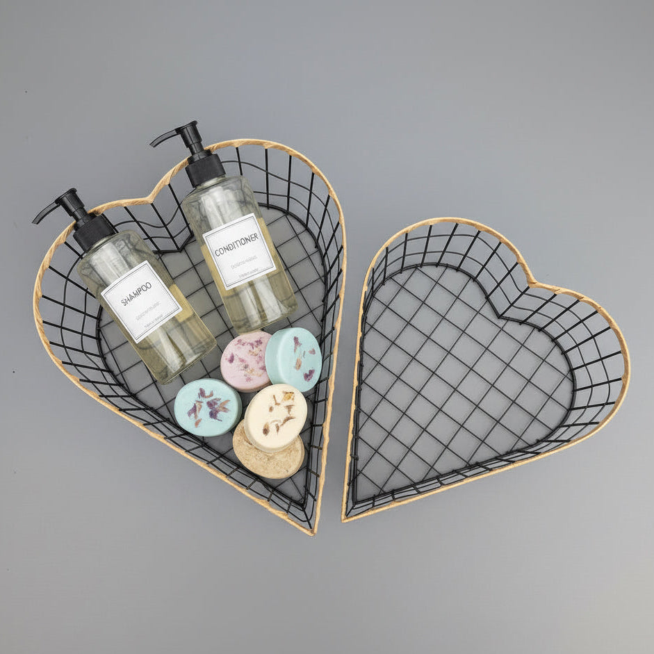 Heart-shaped wire basket with skincare products on a gray background