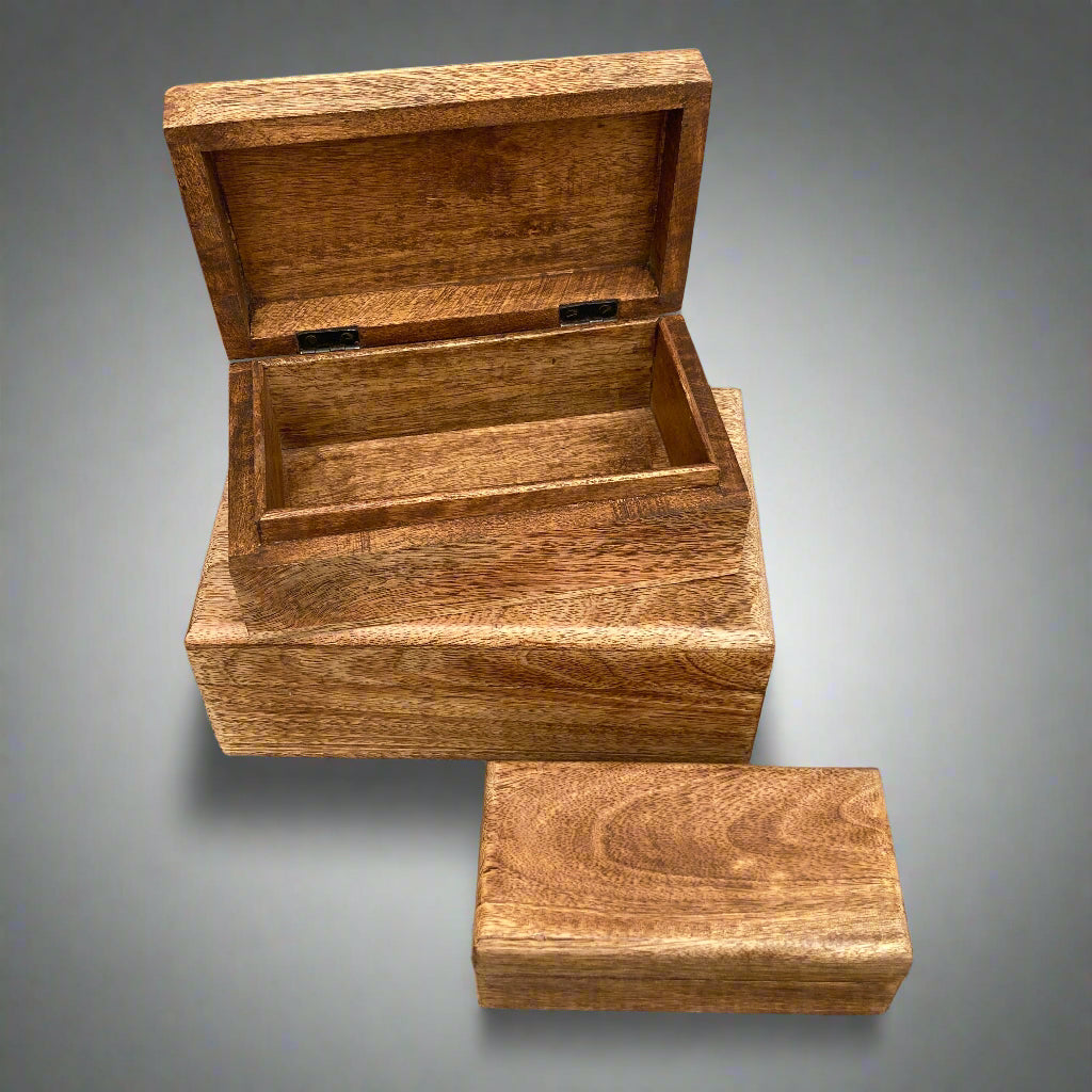 Dark Mango wood rectangular lidded boxes. Medium box open.
