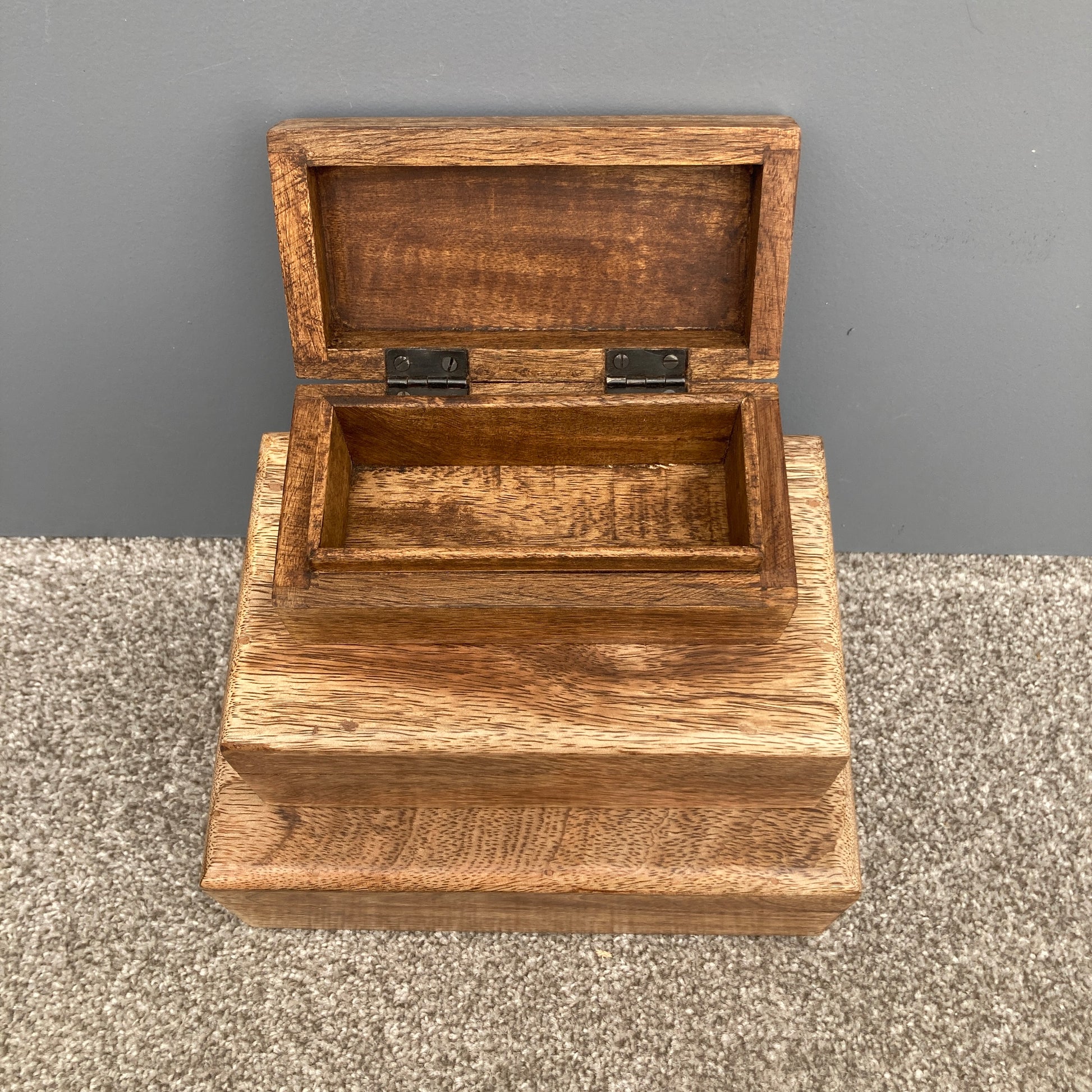 Dark Mango wood rectangular lidded boxes. 3 boxes stacked with small box open.