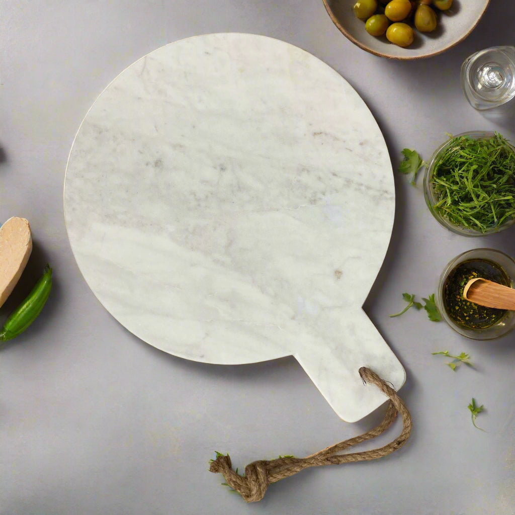 Marble chopping board - round or rectangular design. Round design in kitchen.