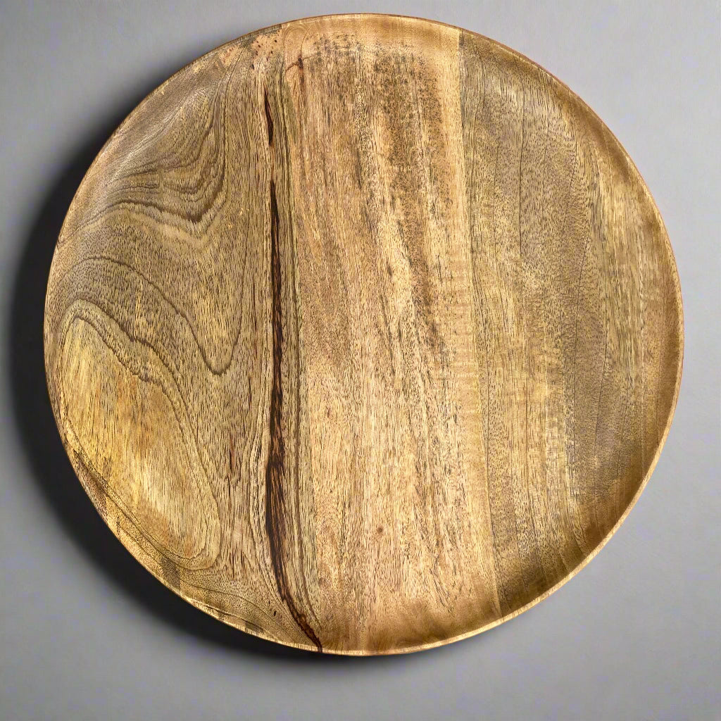 Solid Mango plate in 2 sizes, plate showing on a plain grey surface