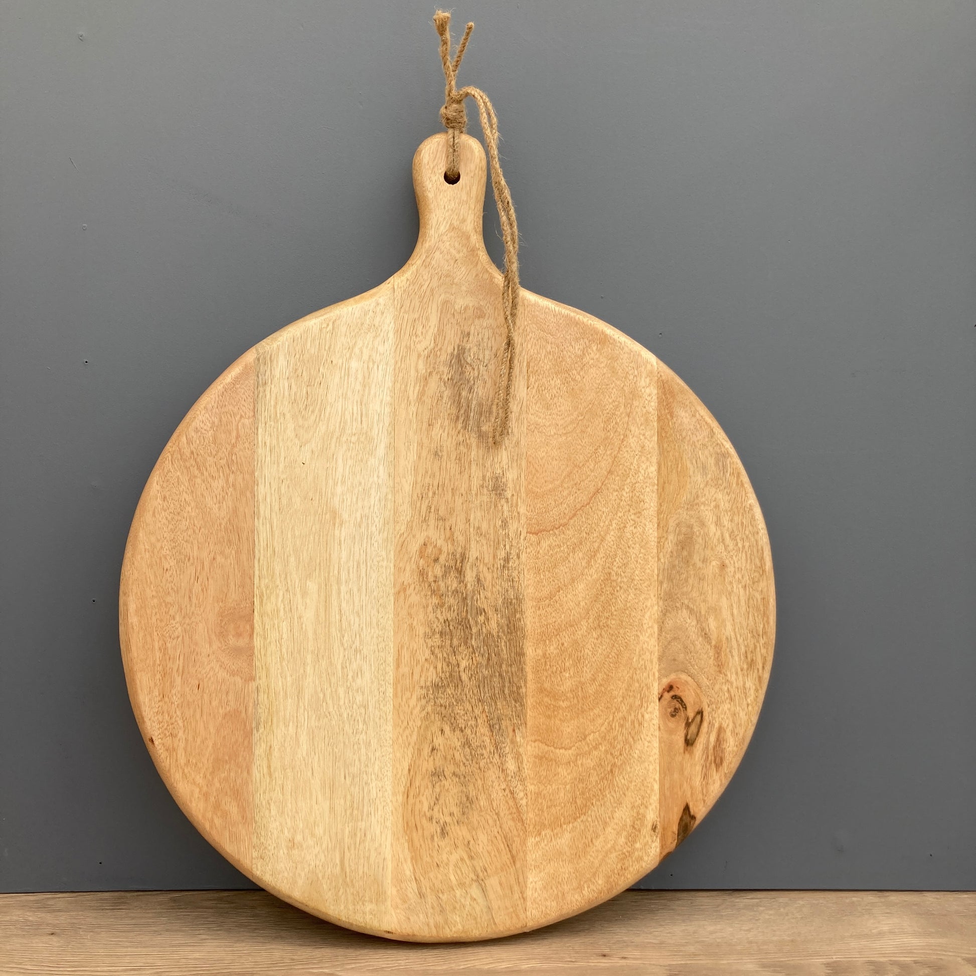 Large Mango wood chopping board on a grey background