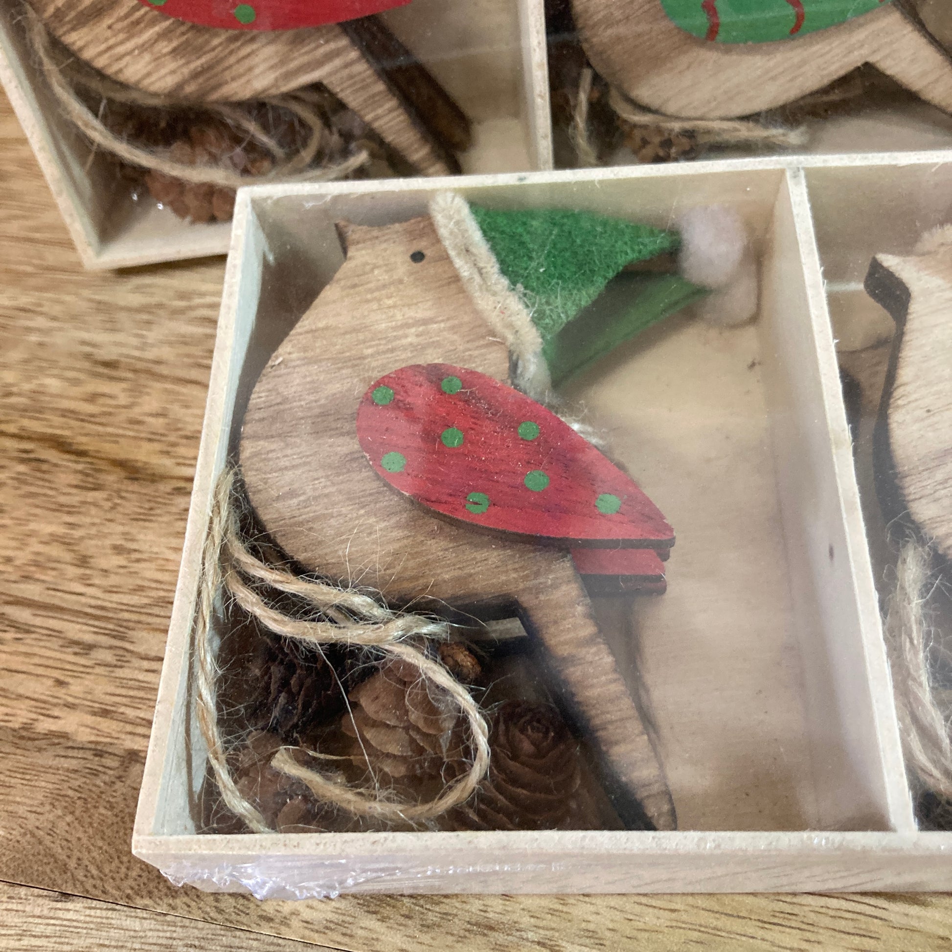 Close up of wooden robin in box