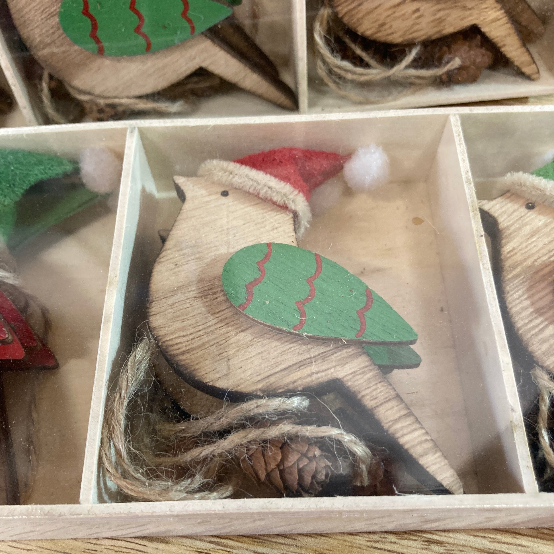 Close up of wooden robin in box - green wing
