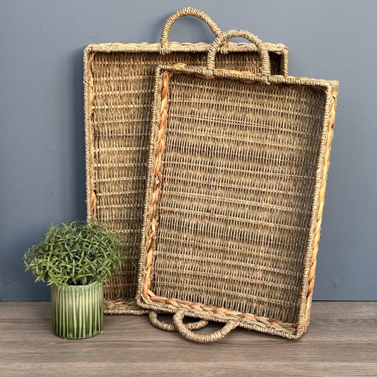Woven seagrass and water hyacinth trays - 2 sizes available stood up on a counter