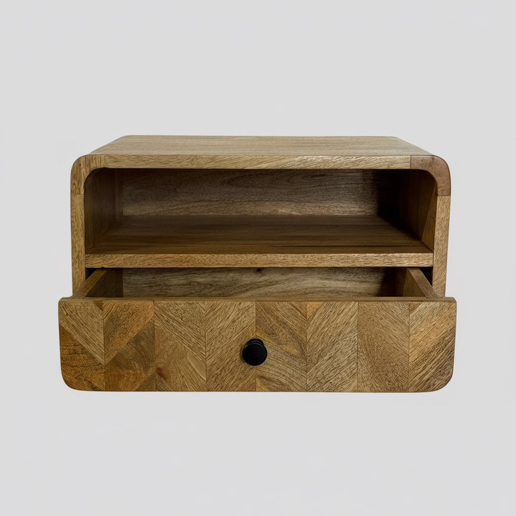 Wooden shelf with a drawer against a white wall