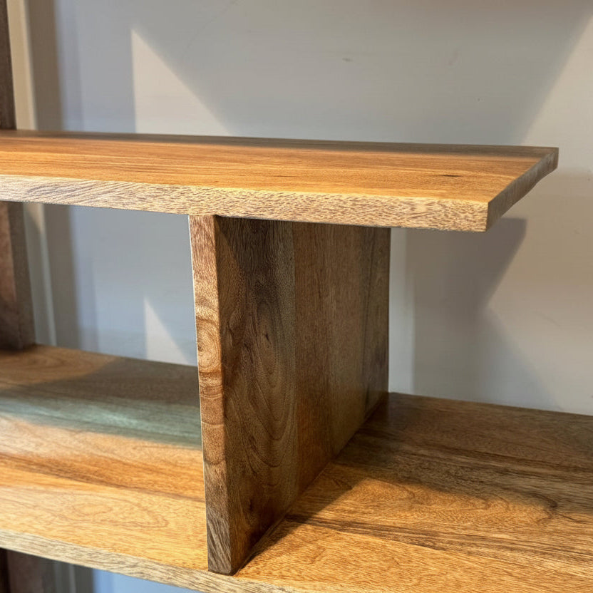 Wooden shelf with a plain background