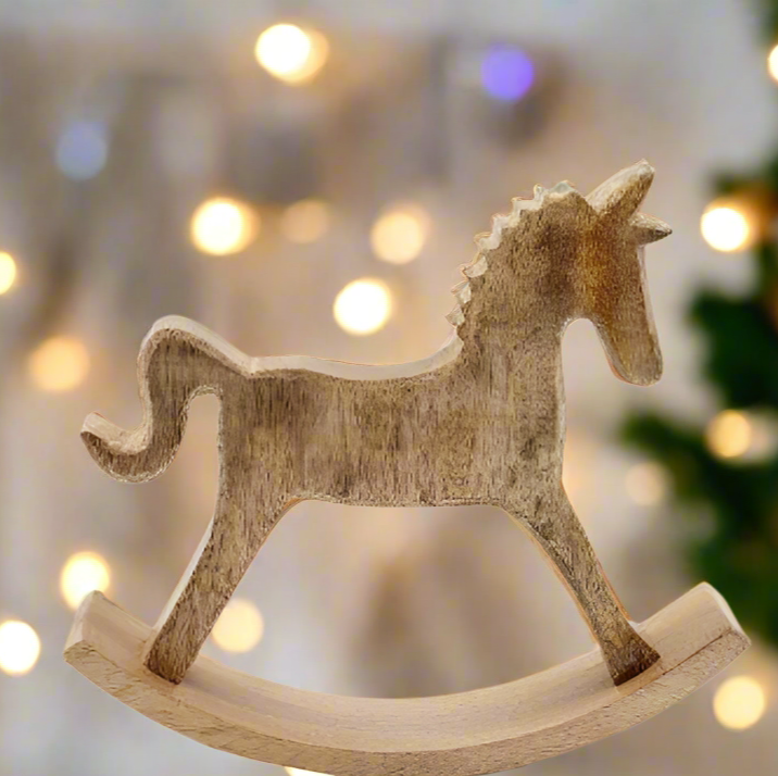 Mango wood rocking horse ornament 18cm high. Lit from behind.