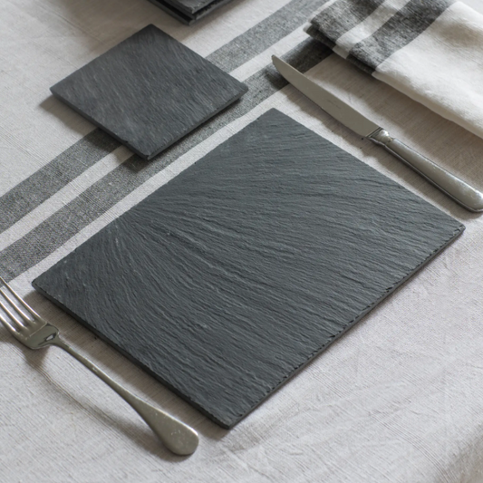 Set of 4 Slate placemats set out for dinner. 