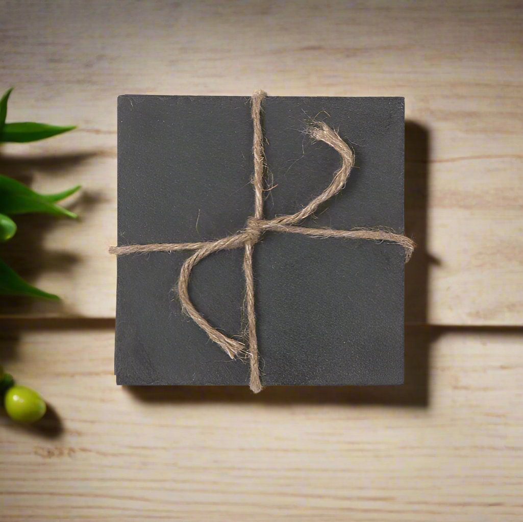 Set of 4 Slate coasters. Tied with string. 