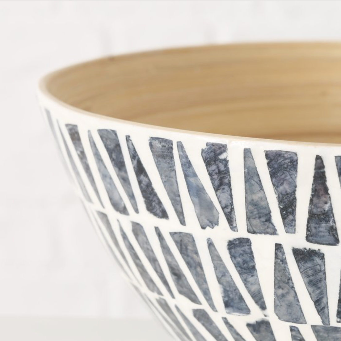 Ceramic bowl with geometric pattern on a white background