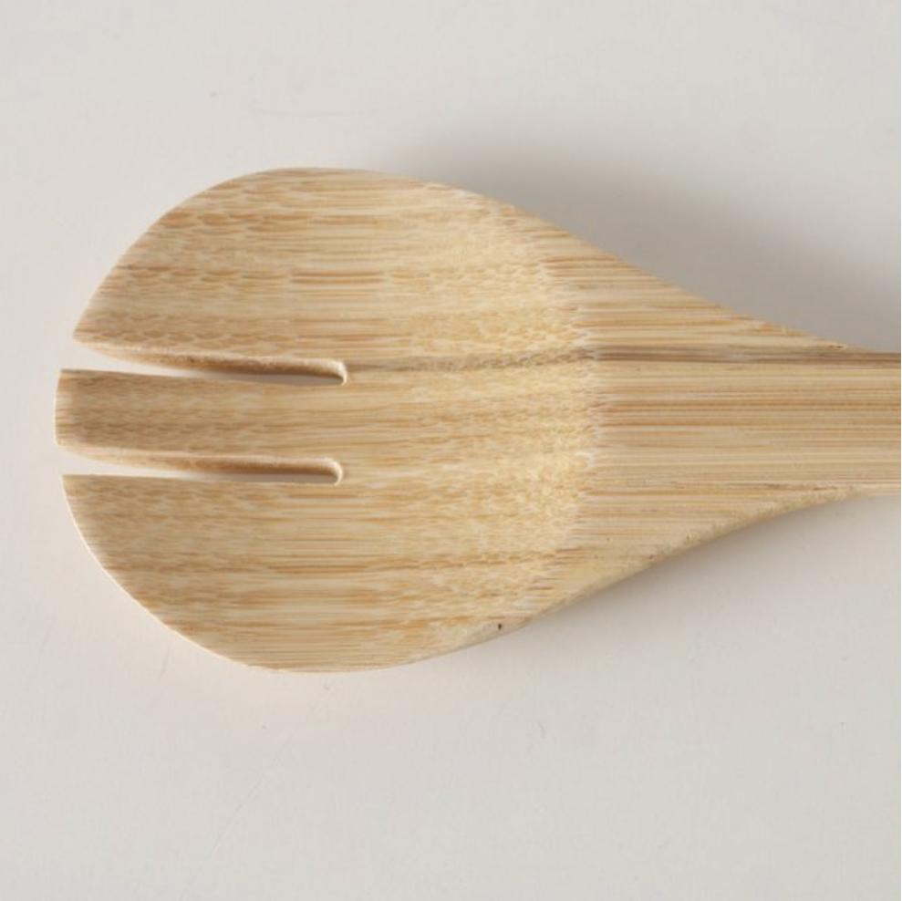 Wooden spoon on a light gray background