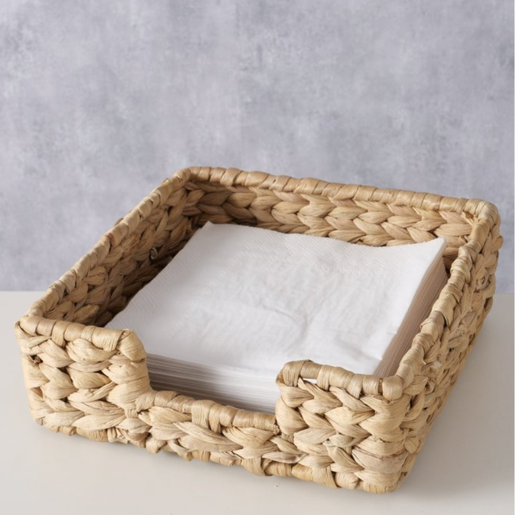 Woven basket with a white interior on a light gray background