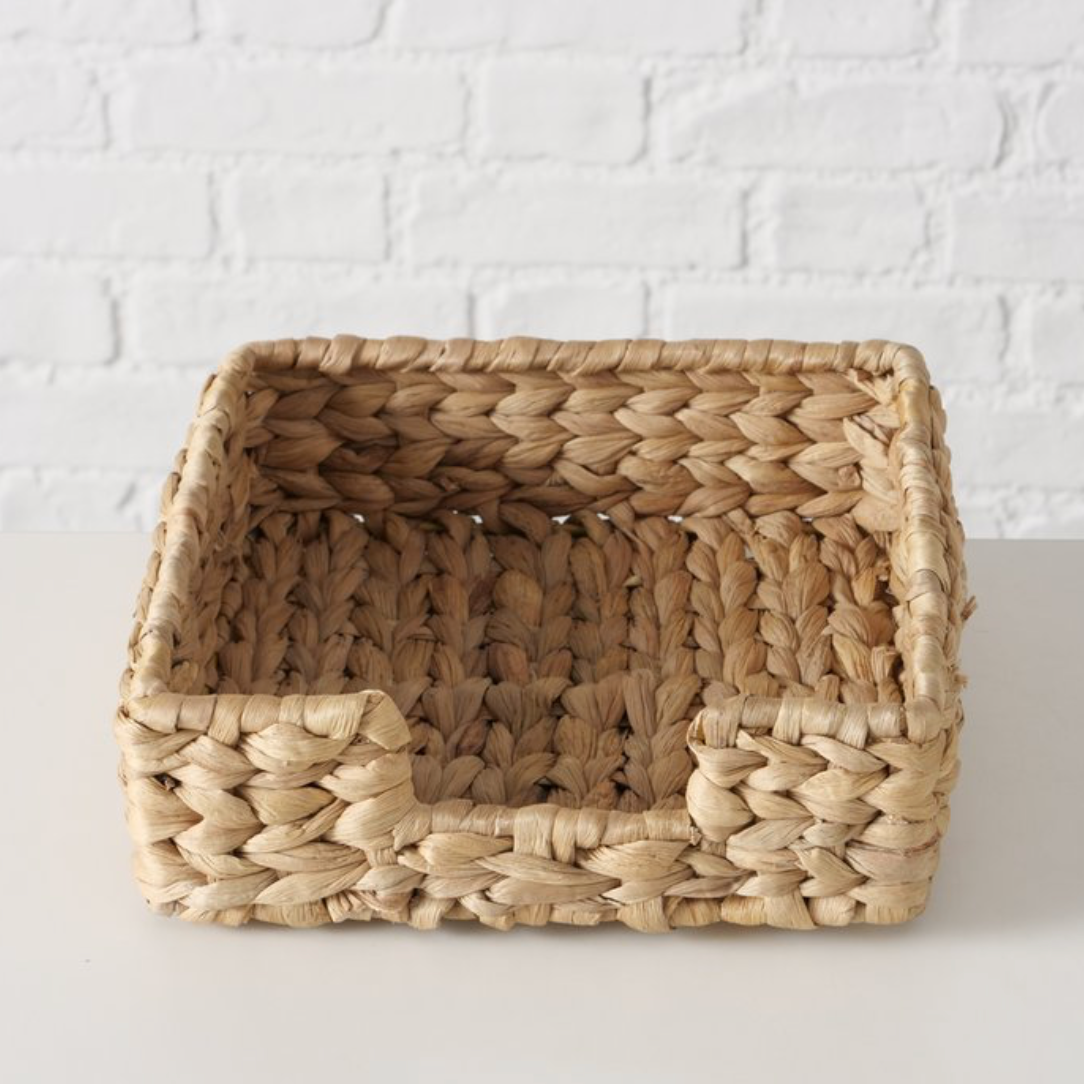 Woven basket with a natural pattern on a white background