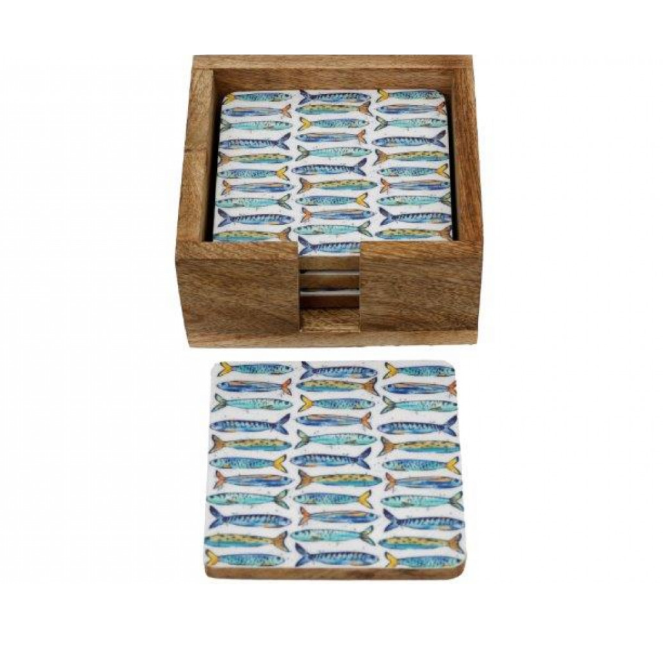 Set of coasters with fish pattern in a wooden box on a white background