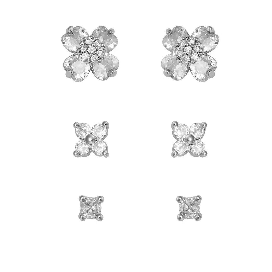 Set of silver flower and square stud earrings on a white background