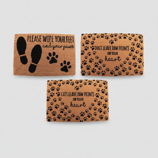 Three doormats with paw prints and text on a white background