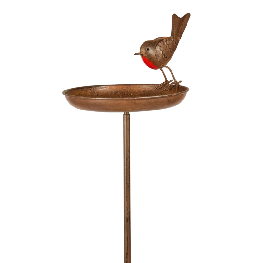 Decorative bird bath with a bird figurine on a white background