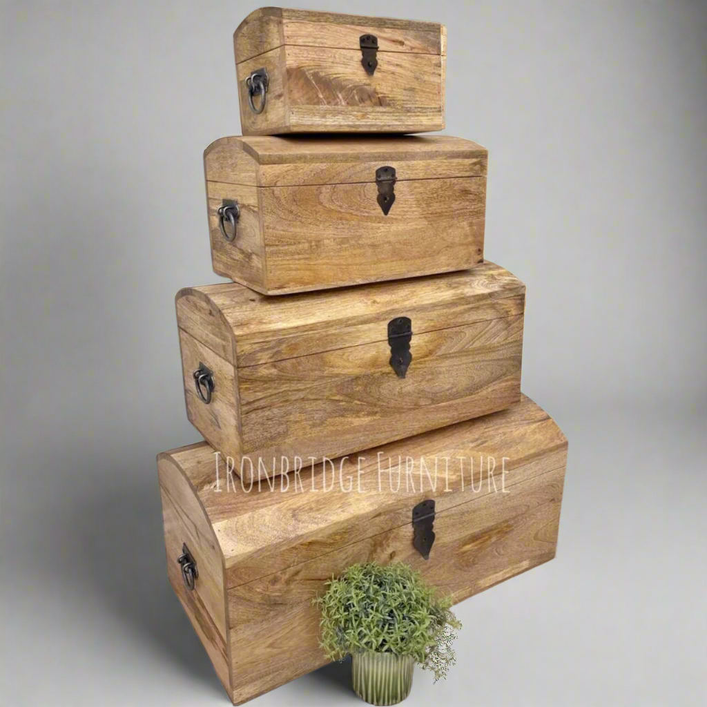 Dome topped treasure chests - Mango wood - 4 sizes available. Stacked on top of each other from an angle. 