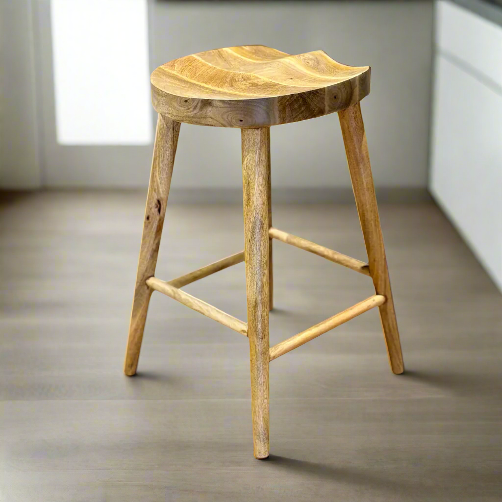 Mango wood bar stool with scalloped seat in a clean kitchen