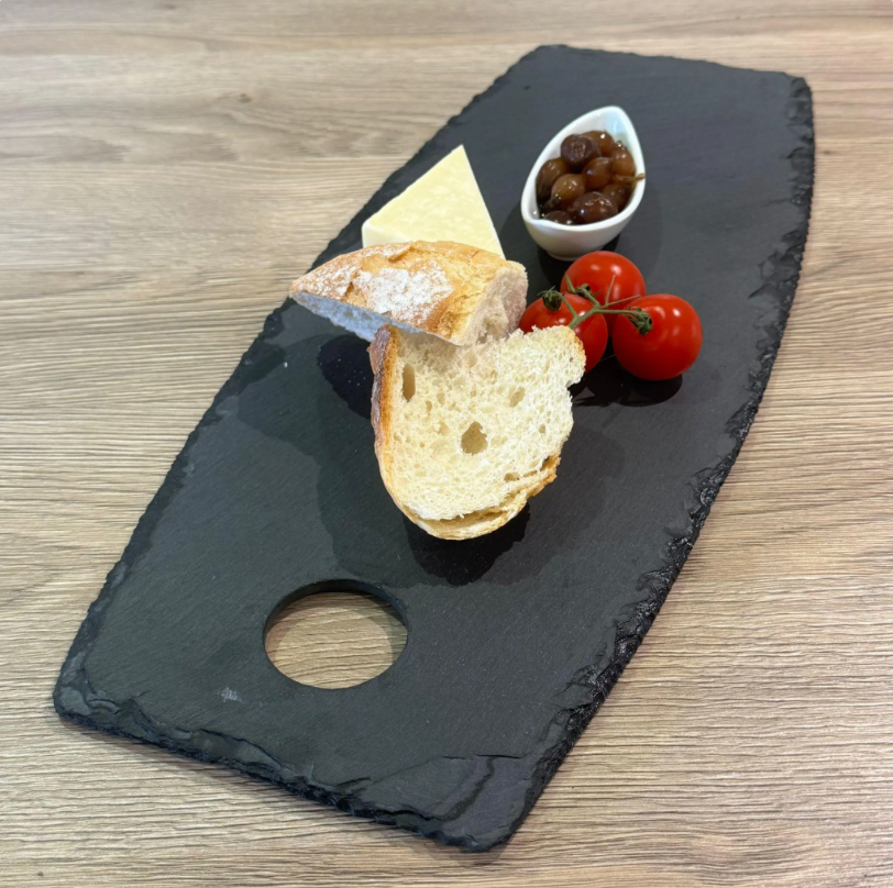 Oval slate cheese board with tomatoes
