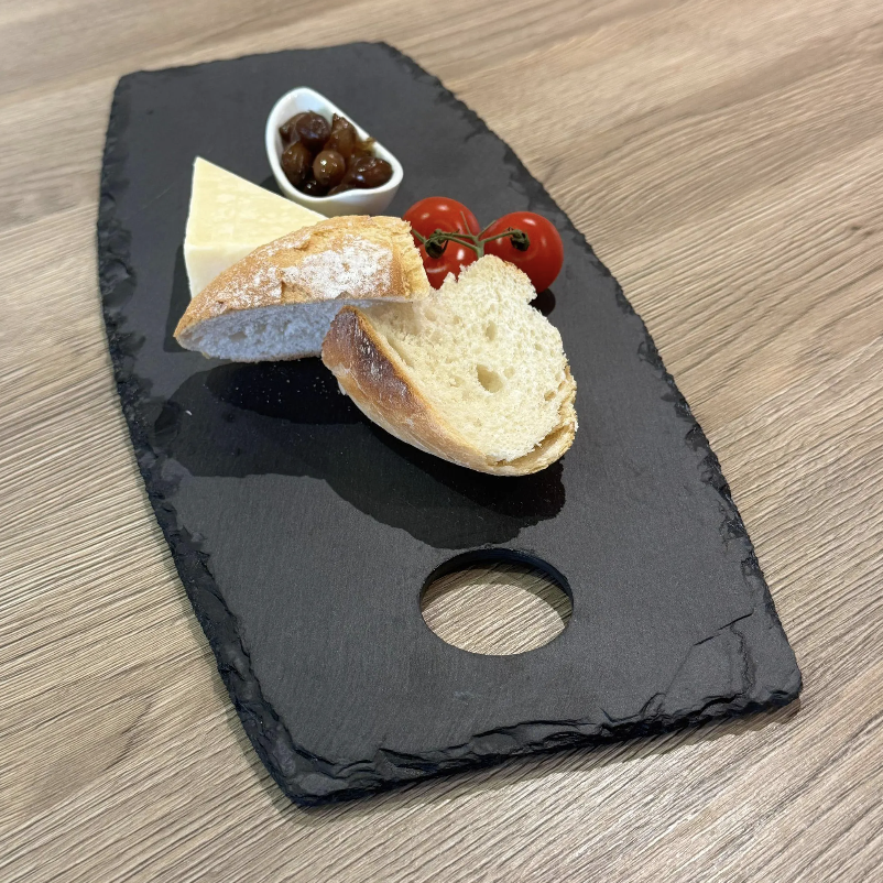 Oval slate cheese board with bread