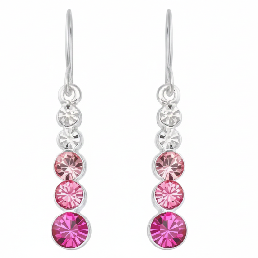 Silver earrings with pink gemstones on a white background