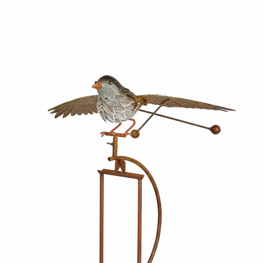 Decorative metal bird on a stand with a white background