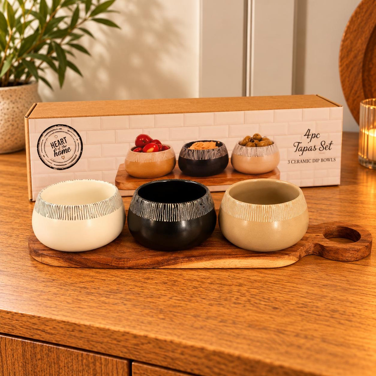 Set of 3 tapas bowls on an Acacia wood serving paddle.