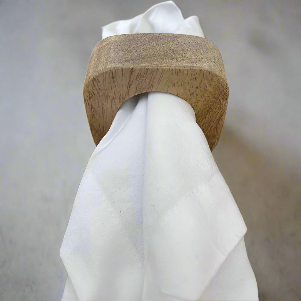 Set of solid Mango wood napkin rings. With napkin.