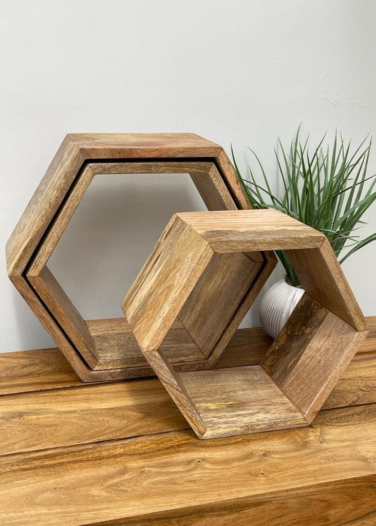 Hexagonal Mango wood floating wall shelves. 3 Shelves on table. 