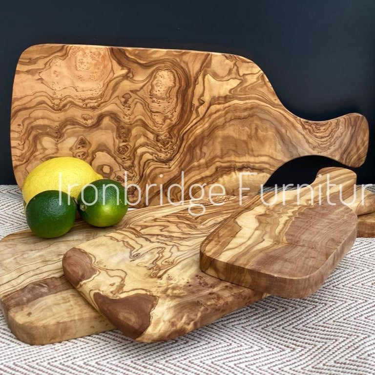 Olive wood paddle shaped chopping board. Multiple sizes shown. 