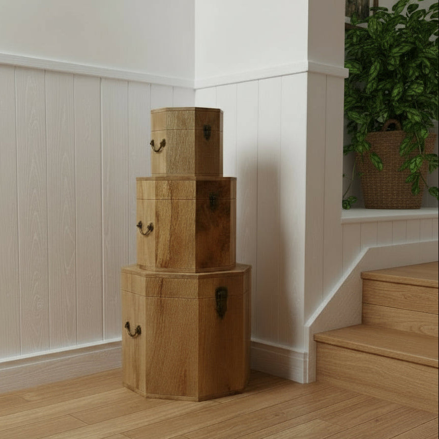 Mango wood octagonal treasure chests in a stack on a floor