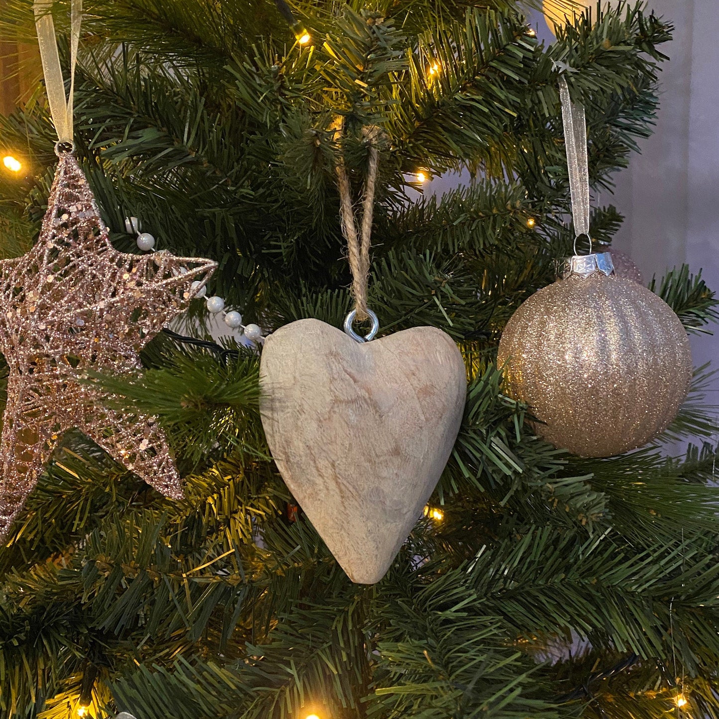 Hanging Mango wood carved heart on a chunky jute string