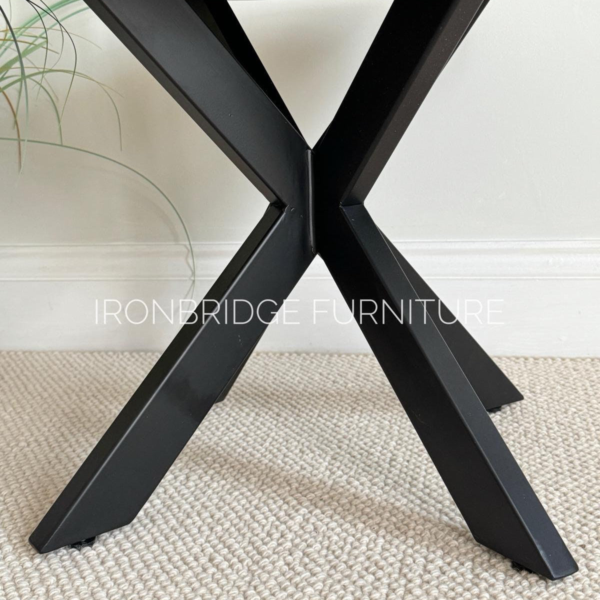 60cm round Mango wood top coffee table with black metal legs. Close up of metal legs.