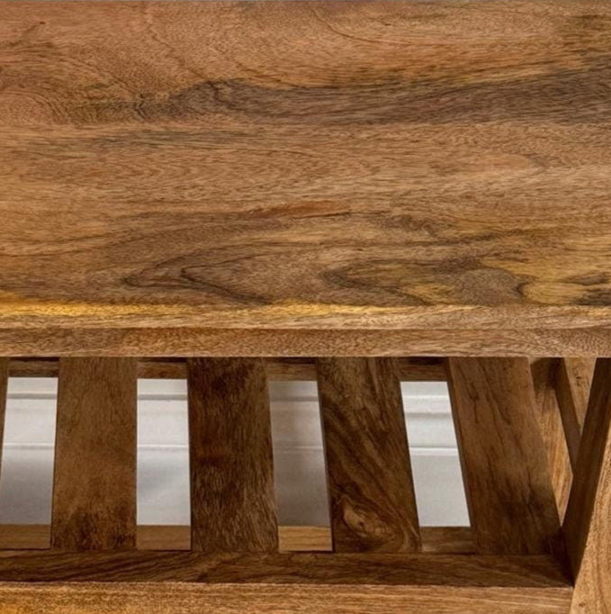 Mango wood shoe storage bench. Close up shot. 