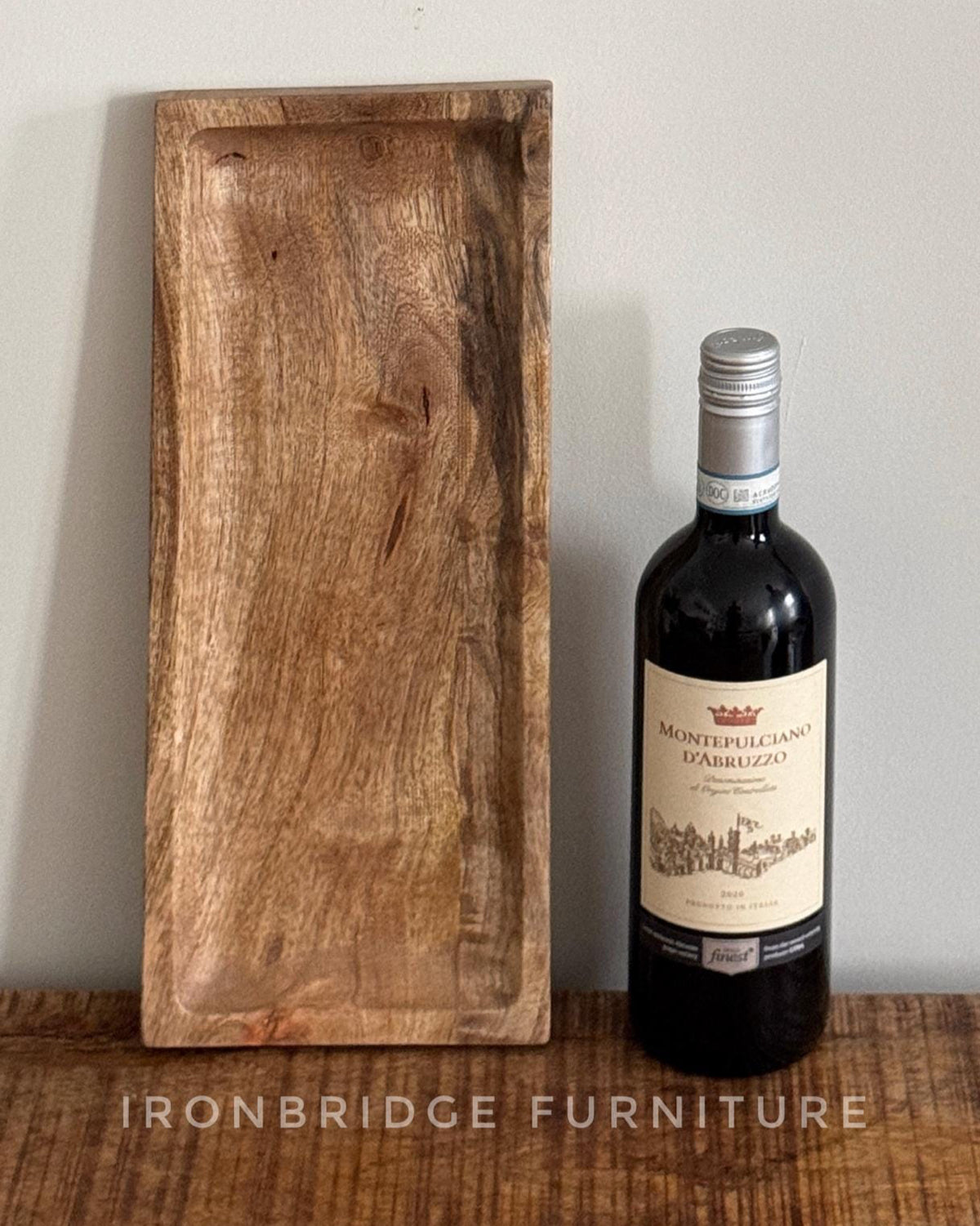 Slim Mango wood condiment tray. Shown with a bottle of wine. 